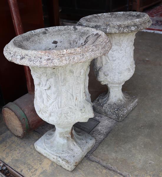 A pair of reconstituted stone garden urns, width approx. 36cm, height 51cm
